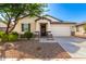 One-story house with front yard landscaping and a two-car garage at 8209 W Lane Ave, Glendale, AZ 85303