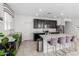 Spacious kitchen with island, stainless steel appliances, and dark cabinetry at 8209 W Lane Ave, Glendale, AZ 85303
