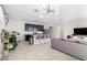Modern kitchen with dark cabinets, island, and open floor plan at 8209 W Lane Ave, Glendale, AZ 85303
