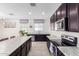 Open concept kitchen with stainless steel appliances and granite countertops at 8209 W Lane Ave, Glendale, AZ 85303