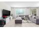 Spacious living room featuring a large sectional sofa and modern decor at 8209 W Lane Ave, Glendale, AZ 85303