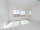 Bright bedroom with large windows and plush carpet at 853 W Golden Ore Pass, Apache Junction, AZ 85120
