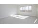 Bright bedroom with carpet flooring and large windows at 853 W Golden Ore Pass, Apache Junction, AZ 85120