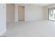 Bright and airy living room with tile floors and access to other rooms at 853 W Golden Ore Pass, Apache Junction, AZ 85120