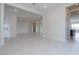 Open concept living room with tile floors and views to kitchen and entry at 853 W Golden Ore Pass, Apache Junction, AZ 85120