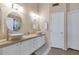 Double vanity bathroom with updated fixtures and large mirrors at 9452 S 51St St, Phoenix, AZ 85044