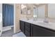 Bathroom with double sinks and shower/tub combo at 9452 S 51St St, Phoenix, AZ 85044