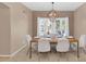Elegant dining room with a chandelier and view of the pool at 9452 S 51St St, Phoenix, AZ 85044