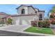 Two-story home with three-car garage and landscaped front yard at 9452 S 51St St, Phoenix, AZ 85044