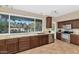 Kitchen features granite countertops, stainless steel appliances, and a view of the backyard at 9452 S 51St St, Phoenix, AZ 85044