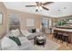 Bright living room with an open floor plan and access to the kitchen at 9452 S 51St St, Phoenix, AZ 85044