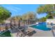 Inviting swimming pool with lounge chairs and a fenced backyard at 9452 S 51St St, Phoenix, AZ 85044