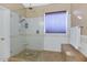 Large walk-in shower with pebble floor and glass enclosure at 9452 S 51St St, Phoenix, AZ 85044