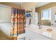 Clean bathroom with shower, sink, and storage at 10288 W Snead N Cir, Sun City, AZ 85351