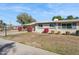 Ranch style home with well-maintained landscaping and a large front yard at 10288 W Snead N Cir, Sun City, AZ 85351