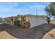 Side view of ranch house with mature landscaping at 10288 W Snead N Cir, Sun City, AZ 85351