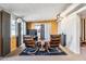 Living area with wood-paneled walls and sliding glass doors at 10288 W Snead N Cir, Sun City, AZ 85351