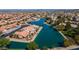 Aerial view of lakefront property with lush landscaping and homes at 10642 W Mohawk Ln, Peoria, AZ 85382