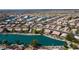 Aerial view showcasing a lakefront community, featuring homes and a tranquil lake at 10642 W Mohawk Ln, Peoria, AZ 85382