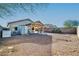 Large backyard with covered patio, storage shed, and gravel at 10642 W Mohawk Ln, Peoria, AZ 85382