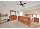 Spacious main bedroom with wood furniture and a ceiling fan at 10642 W Mohawk Ln, Peoria, AZ 85382