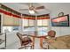 Bright breakfast nook with a table and chairs, overlooking the backyard at 10642 W Mohawk Ln, Peoria, AZ 85382