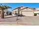 Cute one-story home with a two-car garage and desert landscaping at 10642 W Mohawk Ln, Peoria, AZ 85382