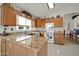 Well-equipped kitchen with granite countertops and ample wood cabinetry at 10642 W Mohawk Ln, Peoria, AZ 85382