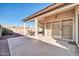 Spacious patio with seating area and sliding glass doors at 10642 W Mohawk Ln, Peoria, AZ 85382