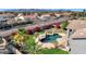 Aerial view of house with pool and landscaped backyard at 11224 N 152Nd Ln, Surprise, AZ 85379