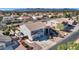 Aerial view of two-story house, landscaped yard, and neighborhood at 11224 N 152Nd Ln, Surprise, AZ 85379