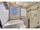 Spa-like bathroom with soaking tub and walk-in shower at 11224 N 152Nd Ln, Surprise, AZ 85379