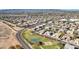 Aerial view of community with homes, park, and roads at 11224 N 152Nd Ln, Surprise, AZ 85379