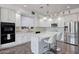 Spacious kitchen featuring white cabinets, stainless steel appliances, and an island at 11224 N 152Nd Ln, Surprise, AZ 85379