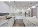 Modern kitchen with white cabinets, granite countertops, and stainless steel appliances at 11224 N 152Nd Ln, Surprise, AZ 85379