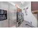 Convenient laundry room with washer, dryer, and extra storage at 11224 N 152Nd Ln, Surprise, AZ 85379