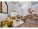 Cozy living room with a mustard yellow couch and a large ornate mirror at 11224 N 152Nd Ln, Surprise, AZ 85379