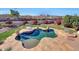 Aerial view of kidney shaped pool and backyard at 11224 N 152Nd Ln, Surprise, AZ 85379