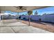 Covered patio and spacious backyard with gravel at 11451 E Broadway Rd, Mesa, AZ 85208