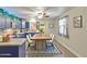 Charming kitchen with blue cabinets, stainless steel appliances, and a dining area at 11451 E Broadway Rd, Mesa, AZ 85208