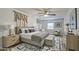 Elegant main bedroom with a well-dressed bed, stylish decor, and ample natural light at 11451 E Broadway Rd, Mesa, AZ 85208
