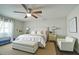 Cozy main bedroom with soft lighting, a comfortable bed, and a serene ambiance at 11451 E Broadway Rd, Mesa, AZ 85208