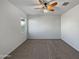 Bright bedroom with ceiling fan and carpet flooring at 11468 E Sunflower Ln, Florence, AZ 85132