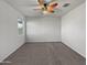 Spacious bedroom with ceiling fan and carpeting at 11468 E Sunflower Ln, Florence, AZ 85132