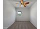 Well-lit bedroom with ceiling fan and carpet at 11468 E Sunflower Ln, Florence, AZ 85132