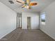 Bright and airy main bedroom with neutral tones and carpet flooring at 11468 E Sunflower Ln, Florence, AZ 85132