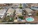 Aerial view showcasing a house with a pool, gazebo, sandbox, and solar panels at 11935 N 148Th Ave, Surprise, AZ 85379