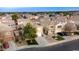 Aerial view of two-story house with solar panels, pool, and playground in backyard at 11935 N 148Th Ave, Surprise, AZ 85379