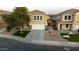 Aerial view of a two-story house with a garage and front yard at 11935 N 148Th Ave, Surprise, AZ 85379