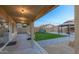 Covered patio overlooking backyard with artificial turf at 11935 N 148Th Ave, Surprise, AZ 85379